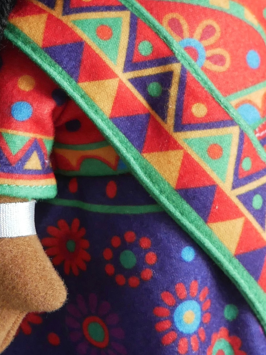 Colorful fabric with geometric patterns and a floral design.